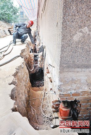 住宅楼楼体出现倾斜 280多台千斤顶扶正一座楼